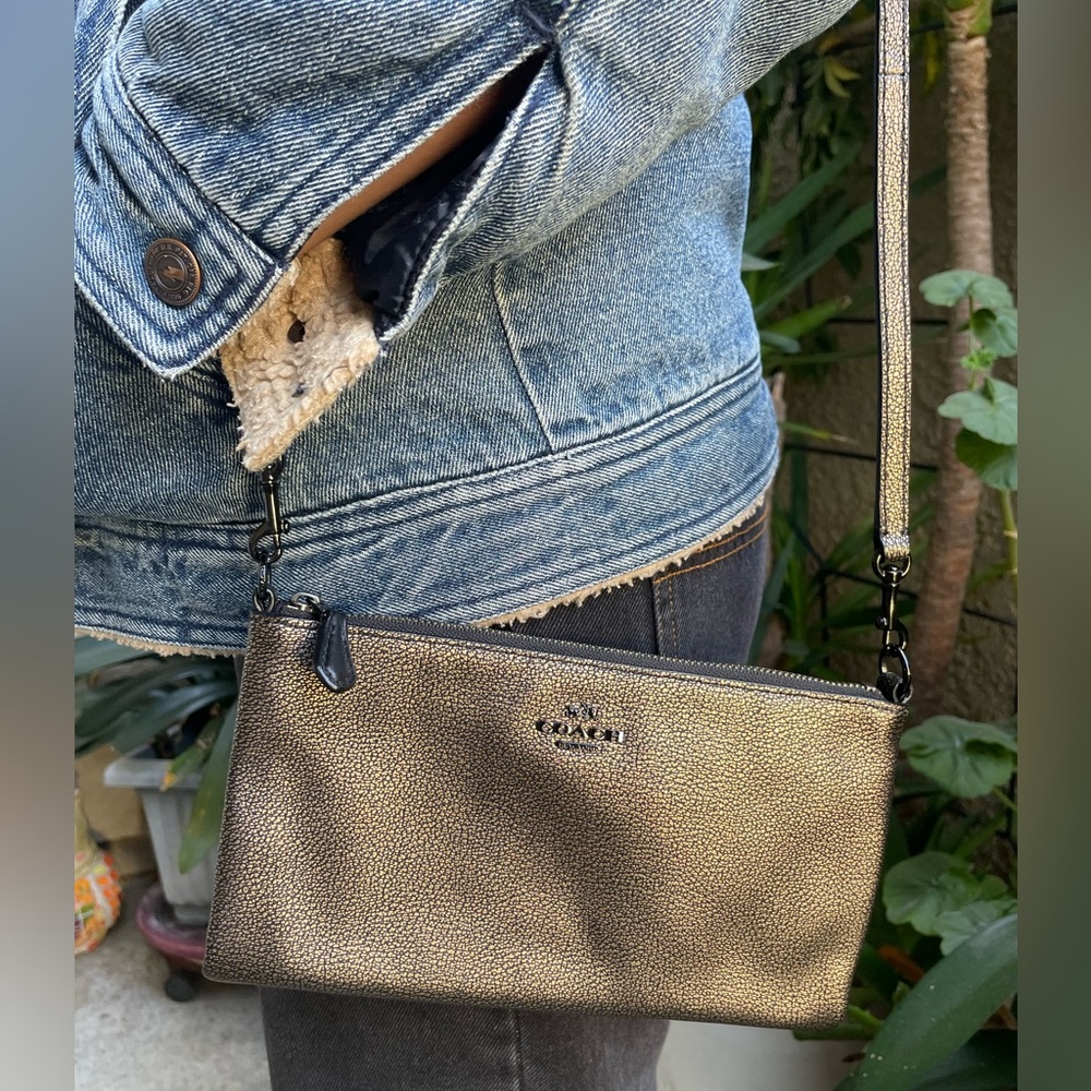 New bronze with black Coach mini leather crossbody bag/clutch